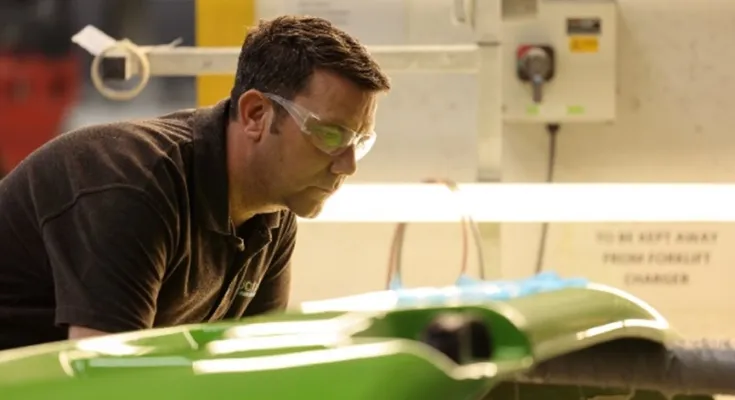 quality control of a green GRP part in our workroom