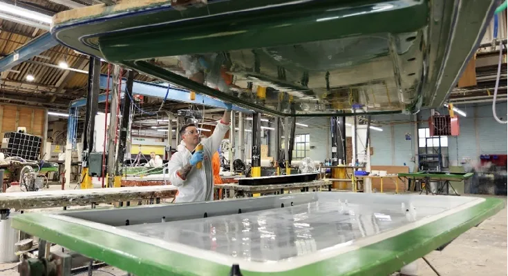 Closing the two halves of an RTM-lite mould during GRP lamination process